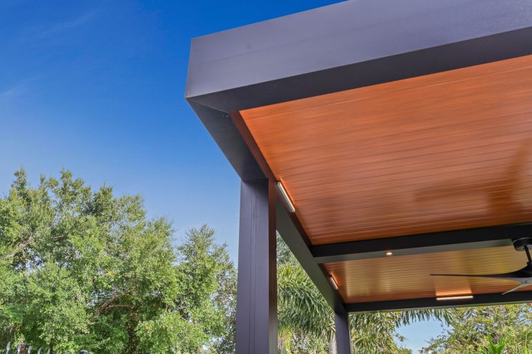 Luxury black R-Shade motorized pergola installation - Cabana Theory outdoor structures