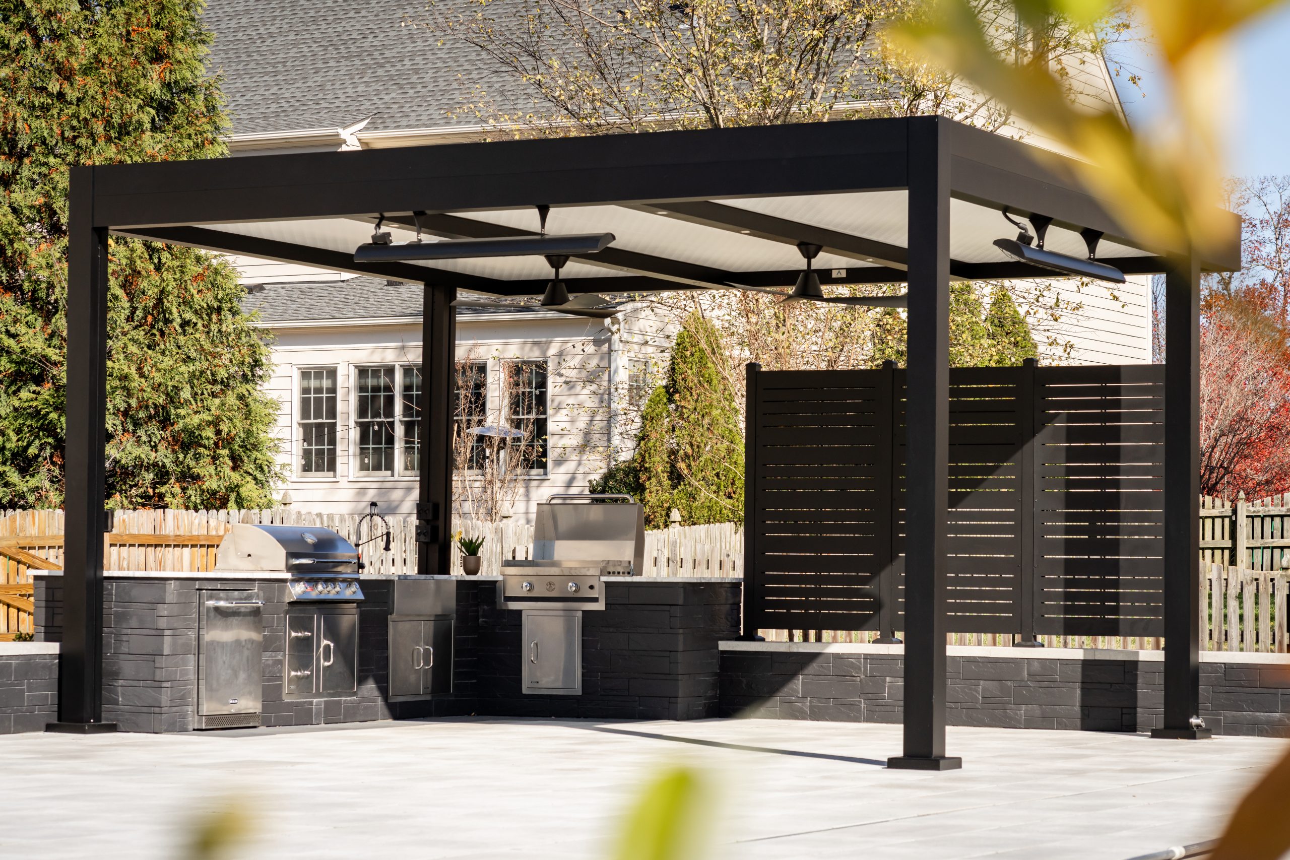 Luxury outdoor kitchen with pergola cover by Cabana Theory