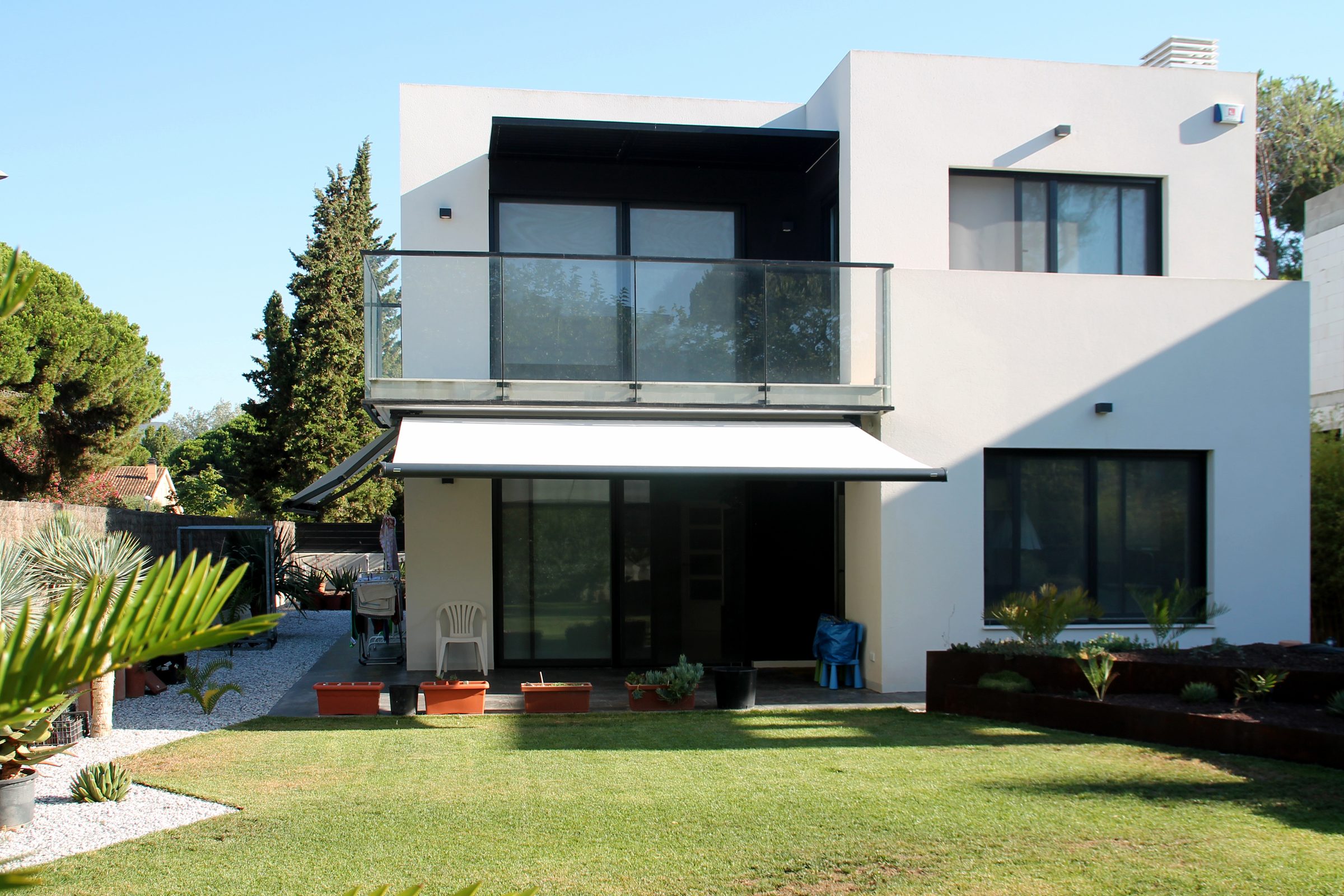 Retractable patio awning extended providing full shade coverage