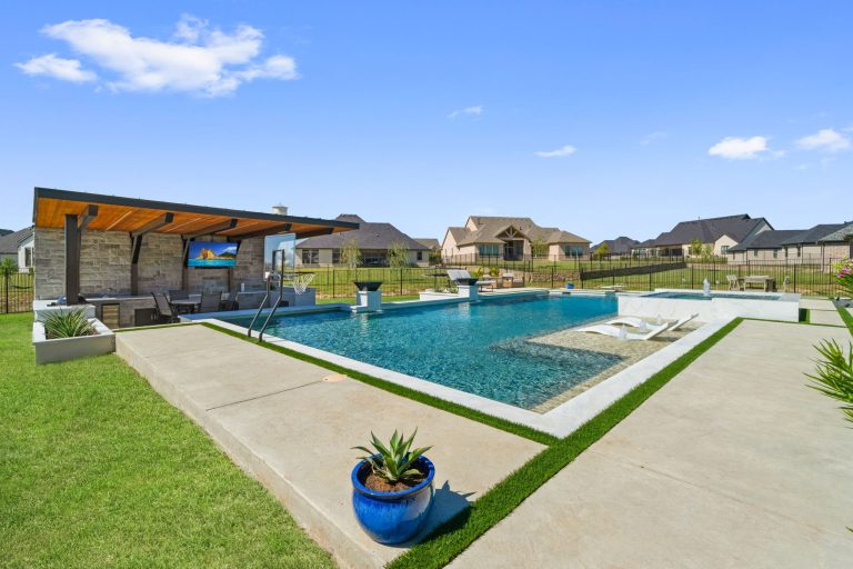 Parker TX patio cover — wide backyard view with pool, putting green and cantilevered structure